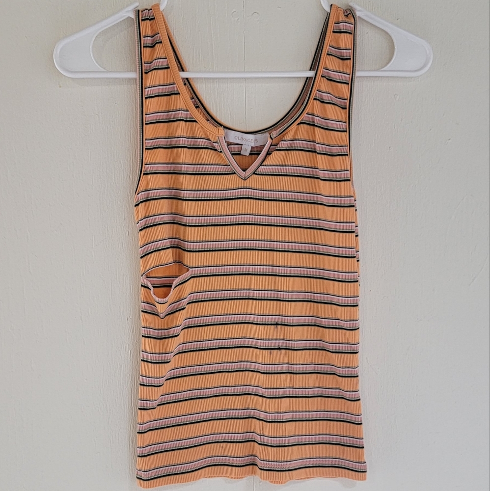 Size Medium Tank top has small stain barley worn
